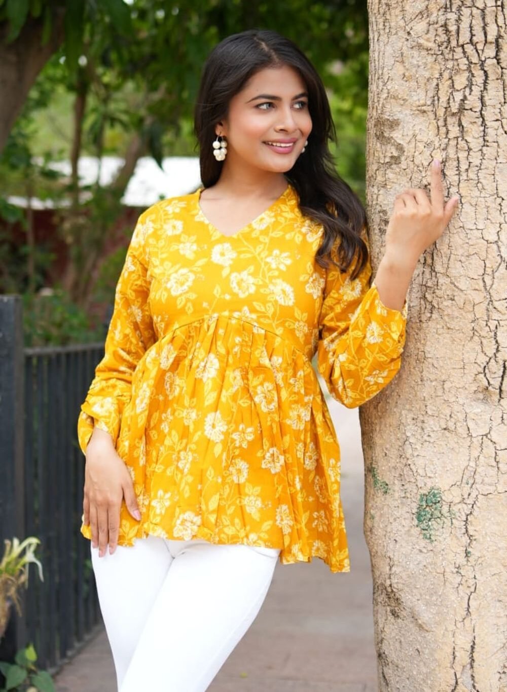 white and pink sleeveless peplum top